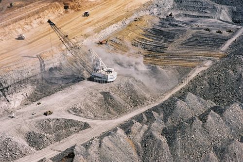 Great aerial shot showing all forms of overburden removal in an open cut coal mine.  dragline, excavator and truck rotation, dozer push - Mining Photo Stock Library