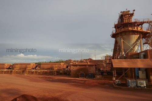 Rail carriages been loaded at  mine site. - Mining Photo Stock Library