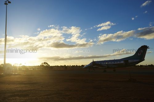 Crew change plane at mine site airstrip.  shot in the late afternoon. - Mining Photo Stock Library