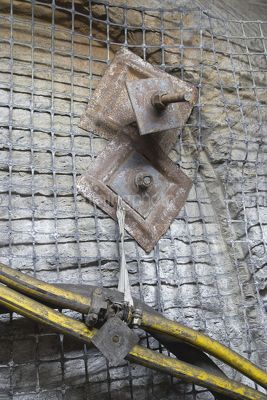 Close up photo of safety mesh in underground coal mine. - Mining Photo Stock Library