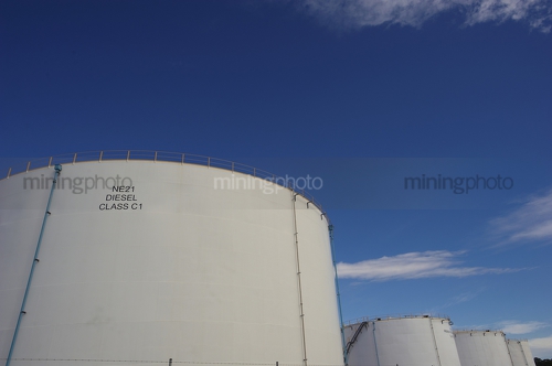 Large fuel storage towers. - Mining Photo Stock Library