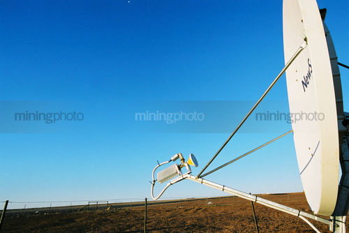 Communication satellite for oil and gas rig workers at remote desert camp. - Mining Photo Stock Library