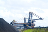 Mining Photo Stock Library - coal reclaimer and loader working stockpiled coal at ship terminal ( Weight: 1  New Image: NO)
