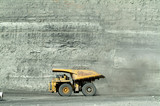 Mining Photo Stock Library - loaded haul truck moving with opencut high walls behind ( Weight: 1  New Image: NO)