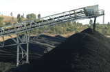 Mining Photo Stock Library - conveyor stockpiling coal with power station smokestack in distance  ( Weight: 2  New Image: NO)