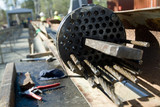 Mining Photo Stock Library - steel wire cable foundation being assembled on outdoor site with workers in PPE out of focus in background. ( Weight: 3  New Image: NO)