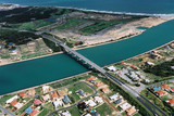 Mining Photo Stock Library - aerial of highway bridge over river near ocean property subdivision  ( Weight: 1  New Image: NO)