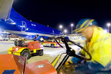 Mining Photo Stock Library - workers in PPE involved in loading a large cargo plane with freight at night at airport. ( Weight: 1  New Image: NO)