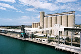 Mining Photo Stock Library - tall storage silos on ship wharf.  aerial image. ( Weight: 2  New Image: NO)