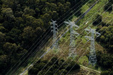 Mining Photo Stock Library - aerial looking down at 3 parallel transformer electricity towers in forest ( Weight: 1  New Image: NO)