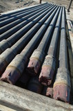 Mining Photo Stock Library - pipe casings laid out ready to install down drill rig oil gas hole ( Weight: 3  New Image: NO)
