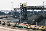 Mining Photo Stock Library - aerial shot of coal train at wharf terminal with stockpiled coal in background ( Weight: 1  New Image: NO)