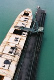 Mining Photo Stock Library - ship loader loading coal into hold at wharf.  aerial shot ( Weight: 2  New Image: NO)