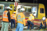 Mining Photo Stock Library - workers in PPE at night on construction site with light rail train zooming past ( Weight: 1  New Image: NO)