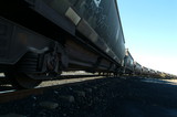 Mining Photo Stock Library - heavy coal train carriages on track.  shot from ground level ( Weight: 4  New Image: NO)
