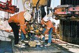 Mining Photo Stock Library - workers on oil gas rig attaching pipe in the hole ( Weight: 1  New Image: NO)