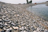 Mining Photo Stock Library - rock wall edge of dam lake water feature in a property subdivision ( Weight: 3  New Image: NO)