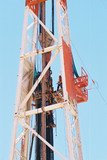 Mining Photo Stock Library - drill rig worker high up the derrick loading pipe into the hole ( Weight: 1  New Image: NO)