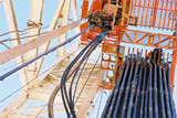 Mining Photo Stock Library - looking up the derrick on a drill rig site to see stacked pipe ready to load into the drilled hole. ( Weight: 1  New Image: NO)
