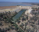Mining Photo Stock Library - aerial of major outback dam.  depicts dam wall, overflow surrounding vegetation and water in stock. ( Weight: 3  New Image: NO)