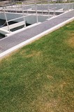 Mining Photo Stock Library - green grass to the edge of water treatment plant ( Weight: 3  New Image: NO)