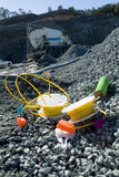Mining Photo Stock Library - colourful blasting equipment next to blast hole on mine site quarry.  close up at ground level with blast truck and gear in background. ( Weight: 1  New Image: NO)