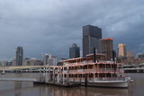 Mining Photo Stock Library - brisbane building skyline after a storm with paddle steamer boat on the river in foreground at wharf ( Weight: 5  New Image: NO)