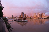 Mining Photo Stock Library - brisbane city skyline after storm with rainbow at sunset.  paddle steamer boat in foreground on the river. ( Weight: 5  New Image: NO)