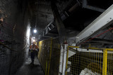 Mining Photo Stock Library - underground coal mine worker walking next to moving conveyor structure. ( Weight: 5  New Image: NO)