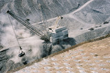 Mining Photo Stock Library - dragline stockpiling overburden in open cut coal mine with filled blast holes in foreground awaiting blasting. ( Weight: 3  New Image: NO)
