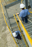 Mining Photo Stock Library - female site engineers walking down stairs.  railings painted safety yellow ( Weight: 3  New Image: NO)