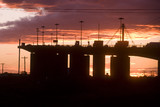 Mining Photo Stock Library - sunset Silhouette image of traffic moving on large bridge.  great colour in sky. ( Weight: 3  New Image: NO)