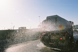 Mining Photo Stock Library - water cart truck spraying on a construction site for dust control. ( Weight: 5  New Image: NO)