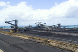 Mining Photo Stock Library - wide panorama shot of coal terminal.  plenty of reclaimers and loaders.  long wharf out to ships being loaded  and ocean in background. great production coal panorama image. ( Weight: 1  New Image: NO)