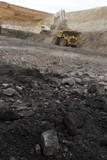 Mining Photo Stock Library - close up of coal in open cut coal mine with wide dramatic background to out of focus haul truck and digger.  vertical image. ( Weight: 1  New Image: NO)