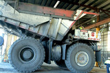 Mining Photo Stock Library - haul truck in maintenance workshop with workers. ( Weight: 4  New Image: NO)