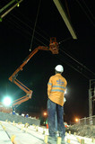 Mining Photo Stock Library - infrastructure worker observing pre cast concrete crane lift during night works.  vertical image. ( Weight: 2  New Image: NO)
