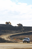Mining Photo Stock Library - light vehicle driving haul road with excavator and haul truck. ( Weight: 3  New Image: NO)