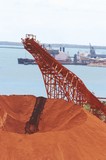Mining Photo Stock Library - bauxite stockpile with loader and ship wharf in background. ( Weight: 3  New Image: NO)