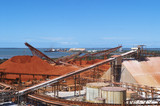 Mining Photo Stock Library - bauxite stockpiles at alumina proecssing plant.  shipping and wharves in background. ( Weight: 1  New Image: NO)