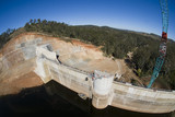 Mining Photo Stock Library - Construction of a dam. Aerial shot from crane bucket. ( Weight: 1  New Image: NO)
