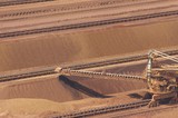 Mining Photo Stock Library - close up aerial shot of iron ore reclaimer working at shipping terminal.  this shot shows the scale of the machinery. ( Weight: 1  New Image: NO)