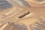 Mining Photo Stock Library - 6 six trucks and water cart parked up at the go line on open cut mine site.  aerial shot. ( Weight: 1  New Image: NO)