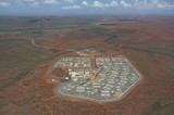 Mining Photo Stock Library - high aerial shot of 3000 person mine camp.  there is wilderness in background way back to horizon.  ( Weight: 1  New Image: NO)
