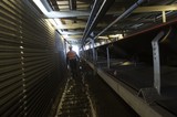 Mining Photo Stock Library - mine worker in full PPE on walkway inside covered coal conveyor ( Weight: 1  New Image: NO)