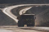 Mining Photo Stock Library - loaded haul truck moving on haul road in open cut mine. dark exposure to capture flashing LED green lights on front to show its loaded. ( Weight: 1  New Image: NO)