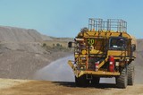 Mining Photo Stock Library - water truck spraying for dust suppression on haul road at open cut coal mine. ( Weight: 1  New Image: NO)