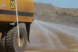 Mining Photo Stock Library - close up of water truck spraying water for dust suppression on haul road at open cut mine. ( Weight: 1  New Image: NO)