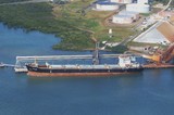Mining Photo Stock Library - aerial photo of a half loaded ship sitting low in the water. blue water.   ( Weight: 1  New Image: NO)