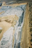 Mining Photo Stock Library - aerial photo of overburden stock piling in open cut coal mine.  excavator and truck rotation and dragline in background. mine access haul roads adjacent. ( Weight: 1  New Image: NO)